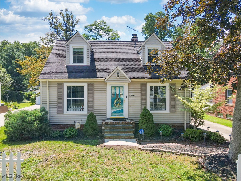Expect to be charmed by this lovely bungalow, located on a quiet street in a desirable area. The home is freshly painted and move-in ready! Enjoy the hardwood floors and natural light on the first floor, where you enter into the living room with a decorative fireplace as the center piece. Two of the three bedrooms can be found on the main floor with a bath featuring a shiplap wall. The kitchen includes a large eat-in area and easy access to the patio and a fully fenced-in back yard. A separate dining area, that is adjacent to the kitchen that features a built in China Cabinet for a more formal atmosphere. The primary bedroom is located on the second floor with a cedar closet and wooden floors. Off the hallway is a small nook that could be used as a sitting area or a place to add a desk. Your lower level includes the utility area along with the laundry area and 2nd bathroom that contains a shower. Move to the nicely updated recreation room that features new flooring and built in shelves. The back yard features a brick patio for cooking and entertainment. Relaxing on the patio is easy in peace as you are surrounded by the wood privacy fence around the entire perimeter, including the driveway. Ideal for families with children or pets. Updates include newer hot water tank and electric box (2021), new second floor windows (2023), new central air (2023), new laminate flooring in the recreation room (2023) and new wood privacy fence (2024). Sewer line was scoped and cleaned in 2023. Seller is offering a one year home warranty for piece of mind. Schedule a showing with your realtor today!