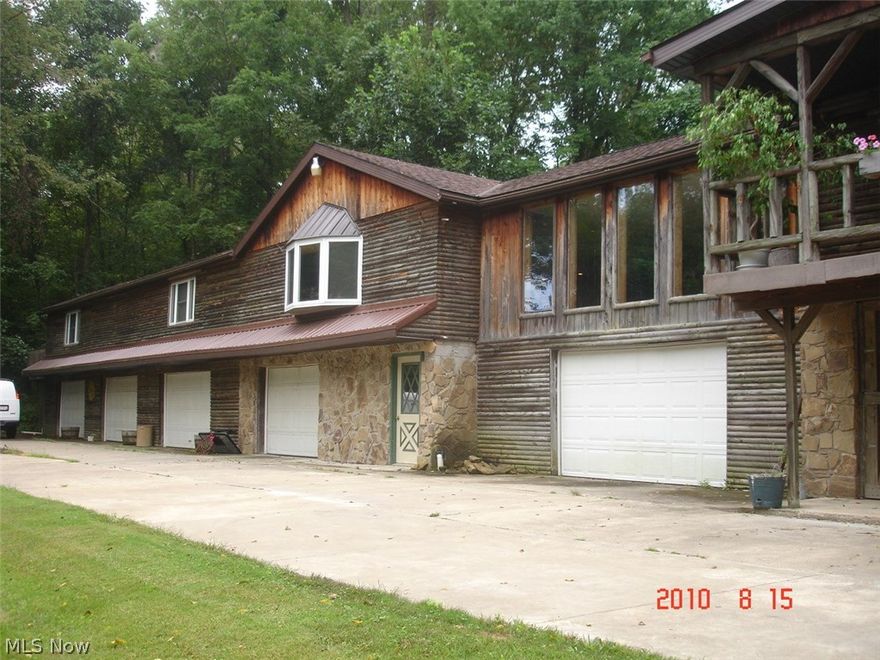 Home to be Sold "AS-IS"   Tremendous possibilities and opportunity in Beautiful LAKE BUCKHORN and truly just a few steps to popular Area 6 of Lake buckhorn!  This home needs work, but it is a 6 Bedroom, 4 Full Bath 3,656 sqft on the 1st floor + nearly 900 sqft finished on the Walk-Out Lower Level.  There also is a 5-Car garage under the house. HUGE ROOMS! This purchase isn't for just anyone.  Quite a bit of Fix-Up and Remodeling is needed, but for the buyer with vision ... this could be such an opportunity.  Call the listing agent for details.   Pics are older pics.