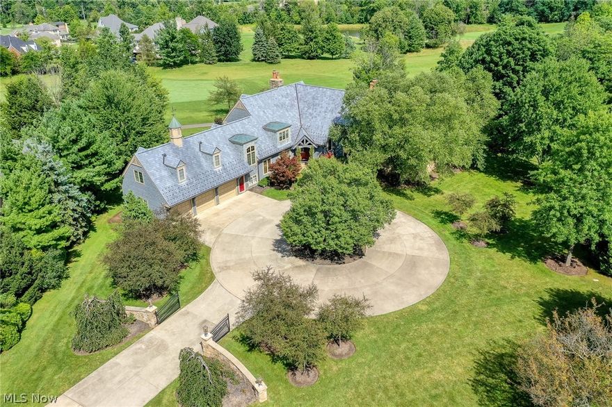 Absolutely stunning custom built home designed by Tony Paskovich & built by Palmieri Homes (former model home). Overlooks the 7th fairway of Jack Nicklaus Signature Golf Course at Barrington. Spread across over 2 acres of Barrington CC, this remarkable estate boasts comfort and charm throughout. As you enter the front gates you will see the beauty of this home, including an offset pergola that creates a separate oasis on your property. Inviting foyer with gorgeous wooden floors throughout flowing to dining room, kitchen, and 2 story Great Room. 1/2 bath off foyer has gorgeous custom ceramic tile and vanity. Huge 2 story Great Room features walls of windows and gas fireplace. 1st floor master bedroom, located off Great Room, features large vaulted ceilings, wooden floors, walk-in closet, and a breathtaking bath. Glamour master bath shows every attention to detail with jacuzzi tub, custom tile work, french door leading to private patio (hot tub connection), and so much more! Picture your