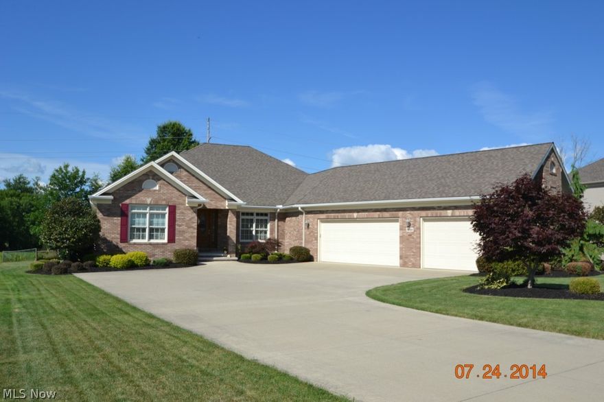 ABSOLUTELY STUNNING custom built home welcomes you to first floor living in an open floor plan.  The kitchen features ceramic tile, granite counters and stainless steel appliances that stay with the home. Gather around a cozy fire in the great room and enjoy the views from the floor to ceiling windows.  The Master Bedroom joins a spacious Master Bath with a double sinked area and has been plumbed for a tub.   Entertain guest in the formal dining area or enjoy the less formal breakfast nook.  First floor laundry and a lovely covered rear deck complete this beautiful home.
The lower level has an extra wide 42" stairway leading to a large rec room which features a bar area as well as a half bath for your convenience.   
There is 3+ car heated garage you will appreciate during those cold winter months and beautiful landscaping you will enjoy in the warmer weather!!