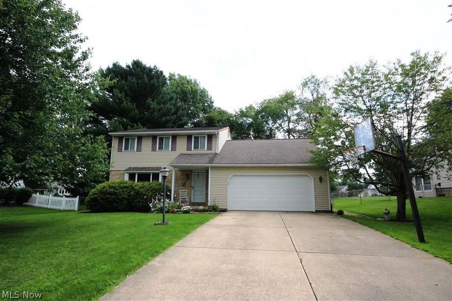 Charming Colonial, nicely updated, on great lot with a private back yard. Updates include but not limited to: Roof 2000, sump pump 2000, central air ’06, 1st floor flooring2011, kitchen w/ stainless steel appliances/granite counters/centre island/ windows 2011, garage door 2011, front bay window 2012, main bathroom 2014 , carpets in main bedroom and more to please. The first floor houses the living room, formal dining room, powder room, an open kitchen and family room opens to a summer enclosed porch and extra patio all with a view of the tree lined backyard. The second floor has the master with private bath, two extra bedrooms share the newly updated bathroom. A full basement and a two car garage completes the picture. Close to all amenities. Ready to welcome the new owners!