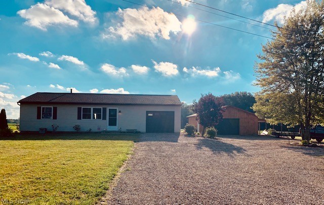LOCATION, LOCATION, LOCATION! Just a hop, skip and a jump away to SR 71. Northwestern Schools. This well-maintained, ready to move into home offers several recent updates including newer siding, windows, shingles, flooring, countertops, appliances, water softener and reverse osmosis system. New aeration septic tank installed July 2019. Currently serviced by FREE natural gas. All situated on 2.4 acres. This property offers ample parking with circular driveway, a one-car attached heated garage and a 28 x 32 outbuilding with attached 12 x 32 carport. Partially finished basement with a large recreation room. Schedule your showing today!