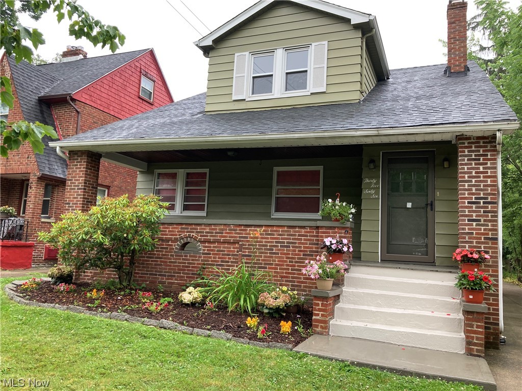 Three-bedroom 1-½ bath charmer on a desirable street in University Heights. Maintenance-free exterior siding, newer roof with dormer. Front and back porches, leaded glass and newer windows, central air (7/23), two-car garage. All surfaces have been modernized—stunning new hardwood floors throughout, porcelain and ceramic tile in kitchen, bathrooms and side stairs. Freshly painted in neutral tones throughout. New stainless steel appliances and newer furnace. Master bedroom on the first floor adjacent to updated half bath. Extra room upstairs could be used as additional bedroom or office. Attic and large basement for extra storage. Ready to move right in.