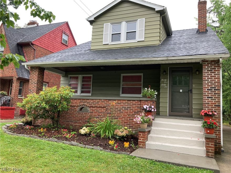 Three-bedroom 1-½ bath charmer on a desirable street in University Heights. Maintenance-free exterior siding, newer roof with dormer.   Front and back porches, leaded glass and newer windows, central air (7/23), two-car garage. All surfaces have been modernized—stunning new hardwood floors throughout, porcelain and ceramic tile in kitchen, bathrooms and side stairs. Freshly painted in neutral tones throughout. New stainless steel appliances and newer furnace. Master bedroom on the first floor adjacent to updated half bath.  Extra room upstairs could be used as additional bedroom or office. Attic and large basement for extra storage. Ready to move right in.