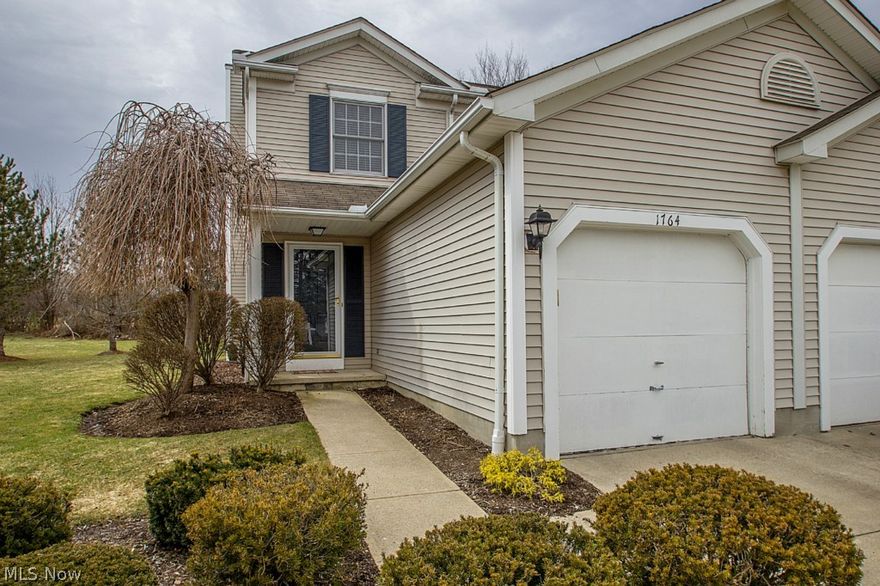 Pride of ownership shows in this wonderful townhome.  The updated kitchen includes all the appliances and dining room adjacent to the family room.  The large family room has laminate flooring, additional accent windows (creating lots of light), and a beautiful brick fireplace with wood mantel.  The laundry area in in the lower level along with a large finished area, perfect for your big screen tv or pool table.  The two spacious bedrooms are on the second floor. The master has two closets and Bedroom #2 has a walk-in closet.  The one car garage has a pull down stairway providing the perfect storage area for seasonal items.  You will have peace of mind with an ugraded furnace and A/C which was replaced within the last 4 years.  The private patio features a brick boarder accent and new lattice privacy wall.  It overlooks grassy common area and boardering trees.  This has a great location close to shopping and highway access.  Townhomes in this subdivision do not come up very often, don't