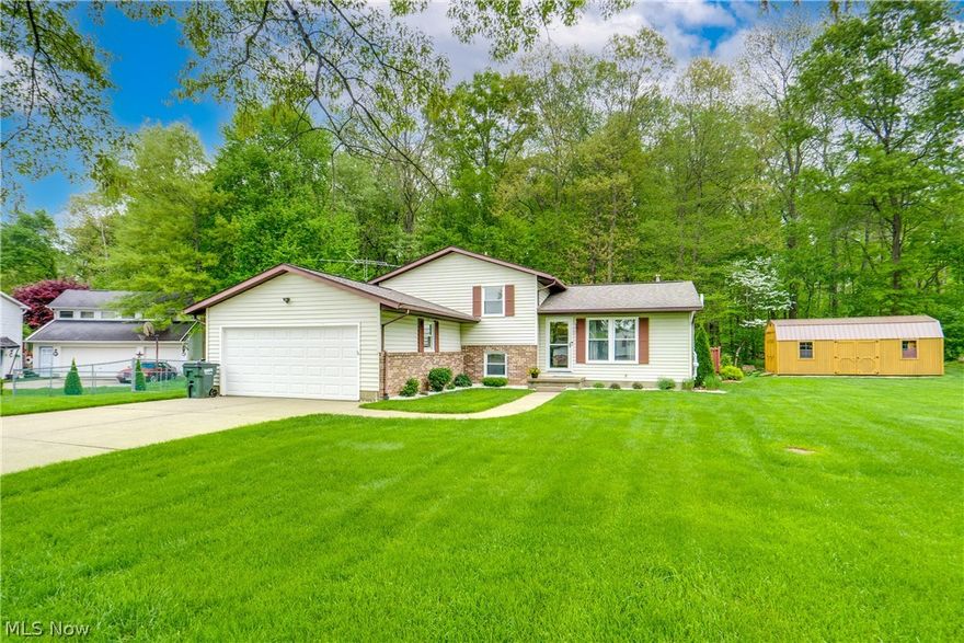 We're so excited to bring you this meticulously maintained home in Northwest LSD! Nestled in a quiet neighborhood on a cul-de-sac, this inviting 4-level Split features three bedrooms, two full baths and updates from top to bottom. As you enter, you're greeted by a spacious living room adorned with Pergo style flooring and warm colors. The open layout seamlessly connects the living room to the dining area and kitchen, creating a welcoming space for guests and entertaining. The eat-in kitchen features stainless steel appliances, granite counters and a charming tile backsplash. The dining area has sliding doors that lead to the tiered back deck. Ascending to the second floor, you'll discover three wonderfully sized bedrooms with newer flooring and paint throughout. The updated/remodeled full bath on this level features ceramic flooring and a convenient shower-tub combo. The lower level of this home is wonderful, boasting a large family room anchored by a cozy stove/fireplace. Adjacent to the family room is a modern versatile office space that could easily serve as a fourth bedroom, offering more space if needed. Another remodeled full bath on this level features a shower and a vanity. You'll love the exterior! There is a two-car attached garage providing ample parking and storage space. Additionally, two sheds, one 24 x 12 and the other 10 x 12 offer even more storage options for outdoor equipment and tools. Step onto the tiered back deck and admire the fully fenced-in yard with serene, private wooded views. Don't miss your chance to see this beautiful home; schedule your showing today!  Truly turn key and move in ready.