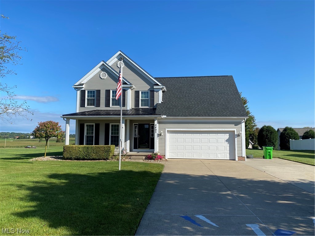 This Newport design, built in 2002, features oak trim and oak doors throughout, formal dining room, first floor laundry room, and a bonus room ideal for bedroom, playroom, or office on the 2nd floor, spacious master suite with a 10by8 walk-in closet and private bath. First floor, open floor plans, makes the home ideal in many ways. Newer windows (2010) radiate natural light. New roof 2018 and wood flooring in 2015. A/C compressor replaced in 2021 along with 2 new exterior doors in 2023. Large outdoor patio with fire pit. Living room fireplace has a wood burning insert that was added. Radon Mitigation system installed. 4 bedrooms, 2.5 bathrooms, private backyard, with amazing views and located at the dead end of Salem St, makes this Lake Township/Lake LSD Home an amazing opportunity.