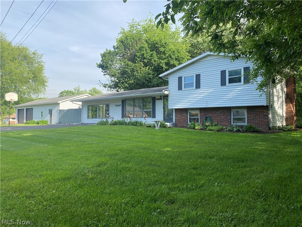 Get lost in your own paradise only minutes from the new Canton South Highschool! Extra large garage for the car enthusiast, adjacent to a hot tub room, leading to an oversized master bedroom with a master bath just across the hall. Open floor plan with a huge rec room and fireplace. Plenty of room to grow into, all on an oversized lot. Only 1 owner. Come check out this extra large property with extra large personality today!