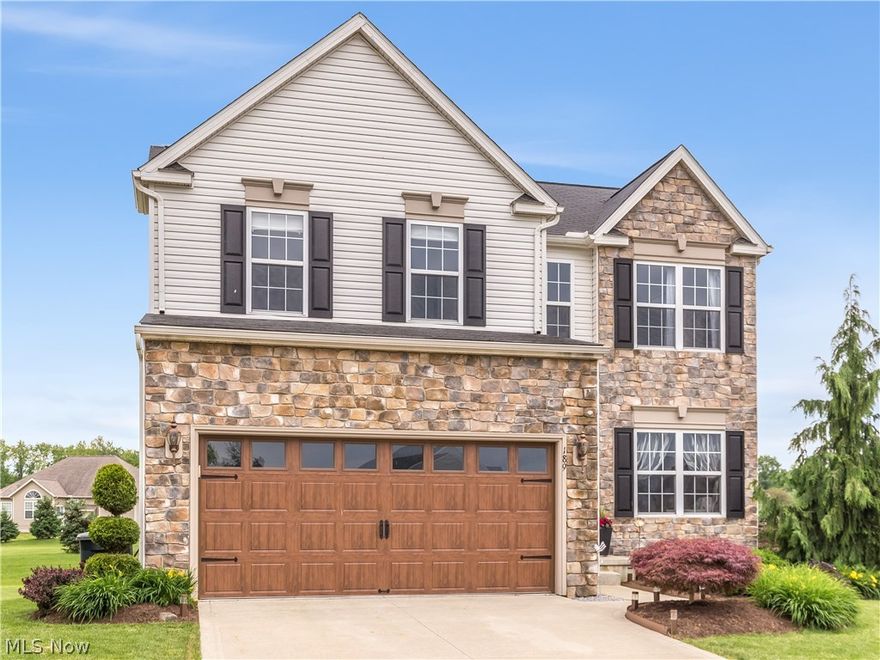 Welcome to 189 Bellmore Ct located in Tiberon Trace of Wadsworth. Built in 2008, this home is as beautiful inside as it is outside. Stunning two-story Great room with gorgeous hickory wall of windows and gas fireplace accented with a white mantel and hand scraped engineered hardwood. The kitchen boasts stainless appliances with granite counter tops, custom tile back splash, large walk-in pantry and added counter space with the 'L' shaped kitchen island (with seating)!  The large dining area (sun room) with floor to ceiling windows creates a naturally bright feel with entry to the back patio and yard making this the perfect space to entertain! The master suite is definitely a place you will want to retreat and relax. The bedroom is beautifully designed with double tray ceilings and a coffered accent wall and the attached master bath features a walk-in closet, double sinks and a jetted tub. Two more bedrooms and a full bath are found across the hall on the second floor.