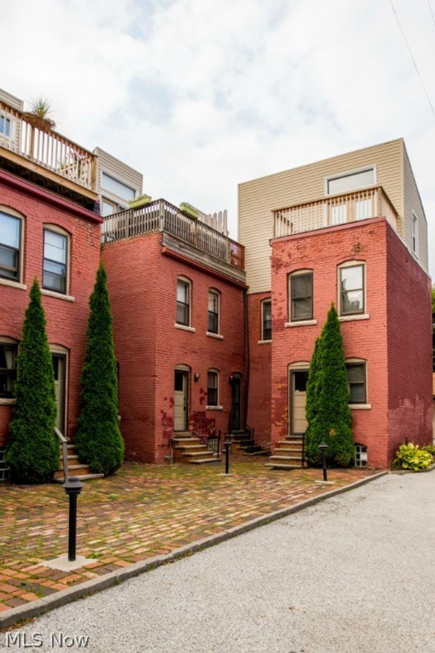 Ready, Set, Move!! The much sought after Ohio City area seems to be all the buzz today. This is your chance to live in the area for a much more affordable price than the new construction units are selling for.  Renovated in 2000 this 3 story town home is perfectly suited to accommodate the busy professional or someone who likes the vibe Ohio City has to offer.  The interior offers 2 bedrooms and 1.5 baths with a deck off the master bedroom along with a finished basement that is perfect for an office or storage.  The kitchen and living room offer an open concept that is perfect for entertaining friends and family.  The location is your gateway into Gordon Square, Ohio City, Lakewood, and Downtown Cleveland with easy access to Battery Park, Lake Erie, Edgewater Park, & Whiskey Island Marina.  The exterior presents a classic brick look which is soon to be redone and refinished.  The unit is an end unit that also comes with a 2-car garage and a great rooftop deck to hang out on and relax w