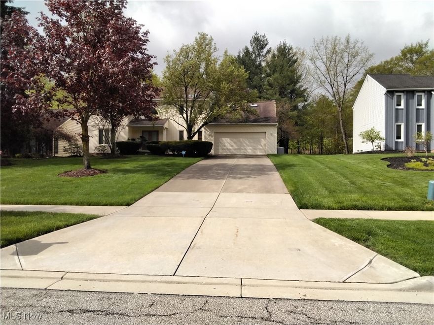 Welcome home to this beautifully maintained Colonial nestled in a friendly and desirable Solon neighborhood, known for its schools and strong sense of community. From the moment you arrive, you're welcomed by a lovely front porch—perfect for relaxing on warm summer evenings. Step inside to find an inviting entryway that opens into a spacious living room to the left and formal dining room, first floor office area with French double doors ideal for hosting friends and family. The majority of the first floor features attractive luxury ceramic flooring and cream color carpet that adds both style and durability. The heart of the home is the eat-in kitchen, complete with a pantry, the spacious dining room flows into a bright white kitchen featuring all stainless steel appliances and a slider that opens to a screened-in porch deck—perfect for relaxing or entertaining. And a brick fireplace that flows seamlessly into the cozy family room. From here, step outside to a private patio and enjoy your backyard oasis. A convenient half bath completes the main level. The stair case to the second floor gives you gone with wind movie look. Upstairs, the primary suite offers a tranquil retreat with a walk-in closet and an in-suite bathroom featuring a step-in shower. Also featuring a step up Jacuzzi tub. Three additional generously sized bedrooms, all with carpeting, share a thoughtfully designed main bathroom with a separate vanity and shower area—perfect for busy mornings. The full basement expands your living space even further with a large recreation room area and bonus room currently unfinished, ideal for guests or extended family. Additional highlights include a newer hot water tank and AC unit, Generac generator, with a two car garage with genie garage door opener and the sellers’ favorite part: the warm, welcoming neighbors that truly make this house feel like home. Don’t miss the opportunity to own this charming home in one of Solon’s most sought-after communities!