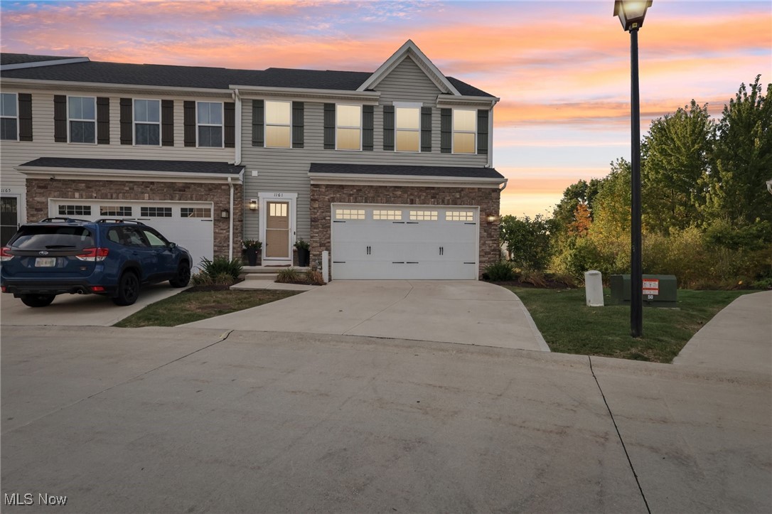 Adorable End-Unit Townhome in the heart of Medina – Just Minutes from Medina Square! Welcome to this beautifully maintained 3-bedroom, 2.5-bath townhome offering an open and inviting floor plan filled with natural light. Nestled on a private lot with wooded views and backing to protected wetlands, this home combines comfort, convenience, and style. Step inside to find a spacious kitchen with newer appliances, a large island, and plenty of cabinetry—perfect for everyday living and entertaining. The main level features upgraded lighting, tall ceilings, a half bath, and wiring for mounted TVs in the living room. Upstairs, the owner’s suite is a true retreat with two walk-in closets, a spa-like bath with a double vanity and a luxurious walk-in shower with dual shower heads and bench seating. Two additional bedrooms, a full bath, and a convenient second-floor laundry room with shelving and storage complete the upper level. The finished basement provides even more living space, abundant storage, and additional wiring for a mounted TV. Outside, enjoy a private backyard with green space and serene wooded views, perfect for relaxing or entertaining. Freshly painted throughout, this end-unit gem is move-in ready and just minutes from Medina Square’s shopping, dining, and community events. Don’t miss your chance to call this charming Medina townhome your own!