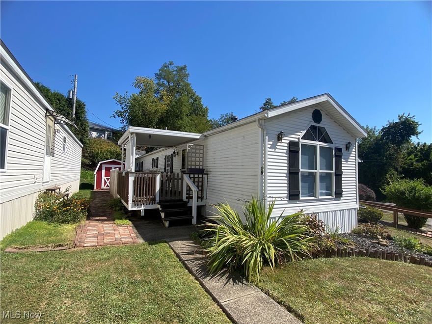 Welcome to 50023 Lin Chris Dr, St. Clairsville, Unit #15. This lovely 1996, 14x72 Dutchman mobile home is located in a nice 50 yrs + resident Wedgewood Mobile Home Complex and is just minutes from the Ohio Valley Mall/Plaza and Memorial Park. The home features 2 bedrooms, 2 full baths, eat-in kitchen, large living room, and a laundry area off of the master bedroom, making your chore of doing laundry convenient. Enjoy the outdoors on the nice covered deck overlooking the beautiful landscaping or in the partial fenced yard, perfect for your small dog. There is also a large storage shed with brick pathway in the yard to hold all your lawn equipment. The home is situated on a leased lot, rents for $338 per month, and has some restrictions. You are able to move the mobile home to your own lot or keep it on the leased lot in the complex. Rental of lot will require the tenant to apply, have a background check done, and pay deposit. Call today for your personal tour of this home.