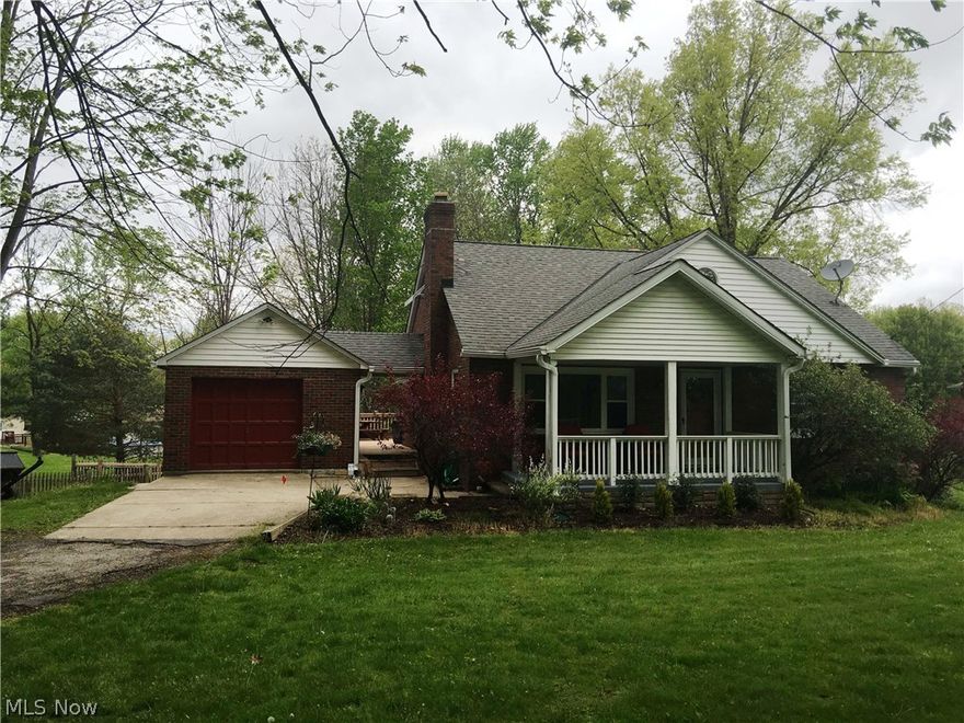 Charming all brick bungalow with large front porch, surrounded by mature trees, set on 2+ acres in desirable Concord. Huge deck on the back of house. This home is super clean. It needs a bit of updating, but has been well maintained. Check out the Unreal Granite kitchen counter. You could remove the carpet and expose its hardwood floors, it will make a fabulous home! It has 2 bedrooms, 2 full bathrooms and potentially a 3rd bedroom in the basement, which also has a full bath and kitchen area, it could be a teen or in-law suite. Basement is also walkout. Loads of possibilities and potential. All appliances stay except the chest freezer. Well water and pump are available. Garage has a basement and foundation was recently repaired. All gutters have Gutterguards.  Excellent location!