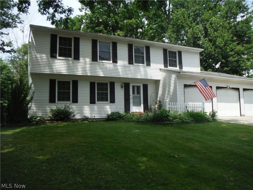 Nice neat and clean four bedroom center hall colonial. Spacious family room with fireplace and sliding doors to the private patio area.  Large wooded lot offers plenty of privacy.  Extra large Master bedroom with nice master bath and walk in closet.  Full basement with drywall walls and ready for the new carpet.  Pella replacement windows and Lenox HVAC system. Home Warranty included.