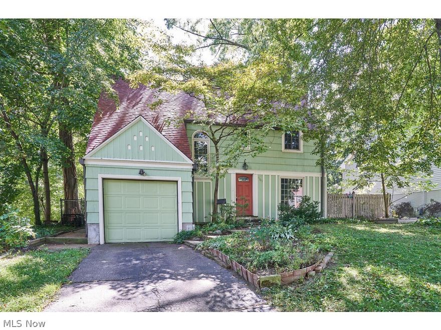 Super charming, updated 4 bedroom, 2.5 bath colonial in wonderful West Akron location 1/2 block from King Elementary.  Lovingly maintained!  Hardwood throughout (ceramic in Kitchen and Rec Room).  Updated Kitchen and baths!  Open floor plan with Formal Living Room flowing into Dining Room and open to Kitchen (with maple cabinets).  Tall windows and sliding doors on first floor offer beautiful views and access to composite deck.  Fenced backyard.  Second floor includes 4 bedrooms (one, halfway up staircase, was used as Office), Full bath, and two hall storage closets.  Lower level includes finished Rec Room, another full bath and Laundry/Mechanical Room plus another storage closet.  Attached 1-car garage.  Lovely wooded ravine views.  New Roof 2020, Newer Exterior painting and maintenance 2019,  HVAC 2014, Waterproofed basement.  Call today for your private showing!