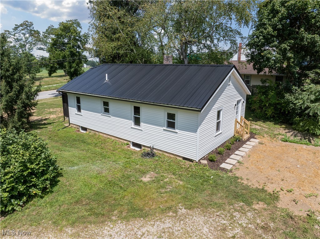 Enjoy country living with a super low maintenance home! The list of updates is impressive and includes new siding, roof, NEW windows, gutters and downspouts. Inside, the beautiful kitchen includes custom, solid wood cabinets. New flooring, paint, plumbing, electrical and fixtures! The original floorplan was changed to now include a 3rd bedroom or office area. Outside, the spacious back yard is bordered by trees, creating privacy and plenty of room for play.