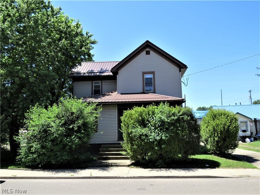 Updated and Affordable 2 Story 3 Bedroom, 2 Bath Home in Carrollton! Here's a great starter or forever home with spacious rooms, and possible first floor master bedroom space. The metal roof was installed in 2019, AC unit in 2018, and other recent improvements include new electric service, glass block windows in the basement, etc. You'll enjoy the covered front porch, and the convenient location which is just a stroll to the square, restaurants, shopping, churches, parks, etc. This property should be eligible for most types of financing. Call with questions or to view!