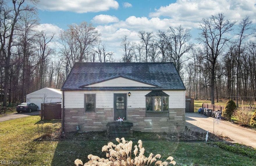 What an opportunity!  Welcome home to 3180 Boston Rd in Brunswick!  This 3 bedroom, 2 full bathroom, raised bungalow is located on over an acre lot!  This is a perfect opportunity to have a small farm while still being close to city amenities!  The home features a covered, concrete patio (roof 2018) to sit underneath to enjoy the fresh air.  Enter the sliding doors to the family room to find a wood burning fireplace and large windows with abundant natural light.  On the main level is the eat-in kitchen, dining/living room with a bay window, and two bedrooms.  A full bathroom is also on the main floor with a great skylight and Jacuzzi tub!  Head upstairs to find a flex space and an additional bedroom off the back!  The bedroom has a great built in desk and the cozy, cottage-like, atmosphere of the upstairs will make you not want to leave! Head to the lower level to find the walk-out basement, an additional flex room, and laundry room!  Home updates include new furnace and AC (2021), new roof (2022) and hot water tank (2019). There was also a new drainage line put in from the woods to the street (summer 2023).

There are 2 chicken coops, an additional outbuilding, and tractor on the property to help you start your farm if you wish.  The current owners have planted an extensive herb garden for the new owners to enjoy, and the treehouse in the backyard (built in 2020) is just waiting to be played in again!  The 4 raised-beds are just waiting for the new owners to plant a garden this spring too.  The 2 car detached garage (roof 2018) has 3 work benches to utilize and there is an additional parking bump-out space off of the driveway.  The fenced in backyard is an outdoor oasis with so much potential!  Come see for yourself!!
