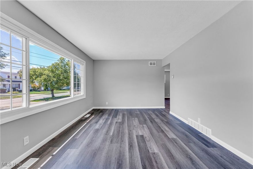 This single-family ranch is the perfect place to call home! You will be impressed, instantly, with the beautiful curb appeal! You are welcomed into the living room featuring gorgeous luxury vinyl plank flooring that continues throughout the home and large picture windows allowing for tons of natural light! Make your way into the renovated kitchen! This updated kitchen features shaker white cabinets, granite countertops and stainless-steel double sink! Down the hall you will find 3 bedrooms! All 3 bedrooms offer closet space, overhead lighting and luxury vinyl plank flooring! The full bathroom has been completely renovated with new ceramic tile tub surround, a new vanity, toilet and light fixtures! The full, finished basement is the perfect space for a rec room, playroom or additional living space! The basement features new glass block windows and has plenty of storage space and a laundry area! Outside you will find beautiful vinyl siding on the home and detached 2-car garage! This home also has central air! With easy highway access, this is near food, shopping and public amenities! This won't last long! Schedule a showing to see it for yourself!