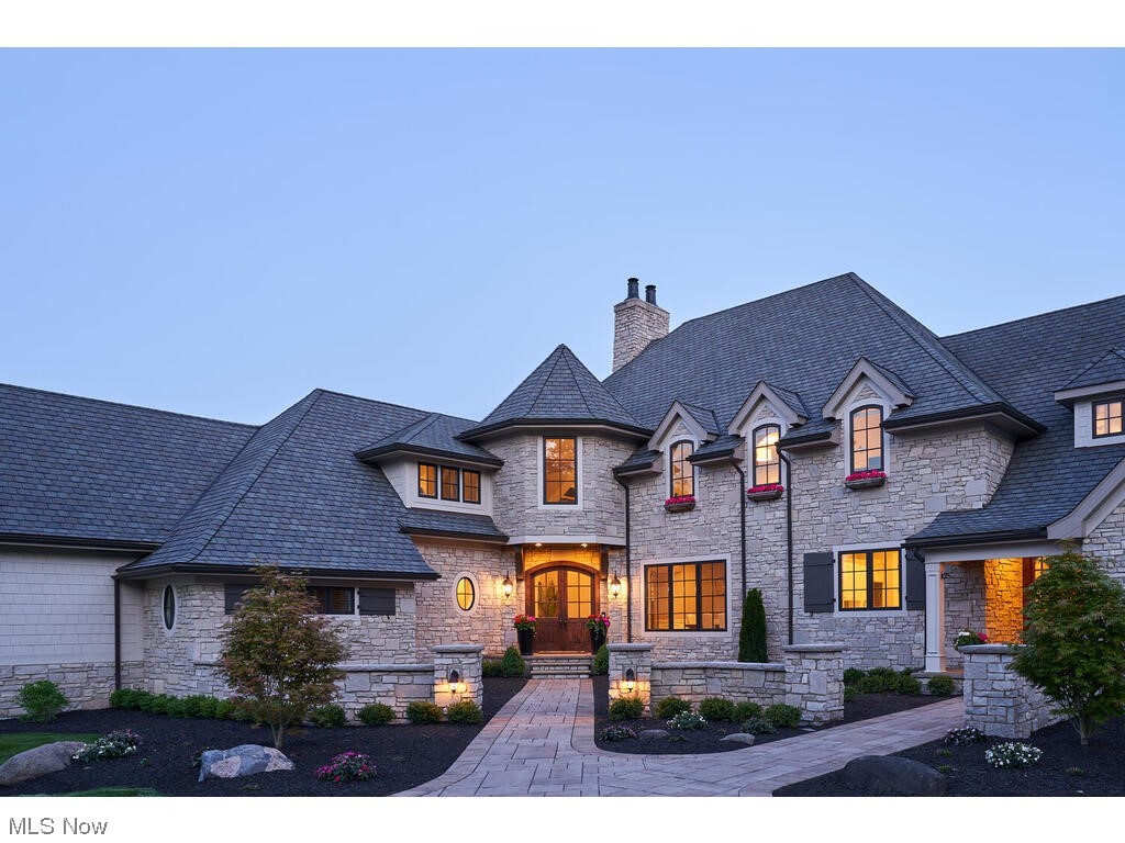 Impressive French Inspired Estate perched hillside overlooking the Bath Nature Reserve, in desirable West Bath Estates, on 2.97 private acres. This signature residence features over $400k in recent renovations and features extensive outdoor living space, pool, & indoor sports court with over 13,000 sq ft of living space inside. The 1st floor has a spacious chef's kitchen that is completely open to the sun room. Great room features a wall of windows with incredible views & 2-story stone fireplace. The owners suite has a fireplace, amazing views of the property and spa-like bath. Private office, dining room, laundry, & mud room complete the main level. Extremely convenient flow directly from the kitchen to the outdoor living space, complete w/wood burning fireplace & outdoor kitchenette. The finished walk-out lower has a bar with seating for 10, family room with fireplace, billiards area, workout room, & stairs lead to the sub basement w/pickleball/basketball court. 1.5 baths in LL. 2nd floor features 3 bedrooms (2 w/en suite baths, 1 Jack-and-Jill), bonus room, laundry room, & secret room behind bookcase (5th bedroom). Dual front & back staircases to 2nd level & lower level. Whole home audio (interior & exterior), 6-car heated garage w/portico. Generator. Call for your private showing today!