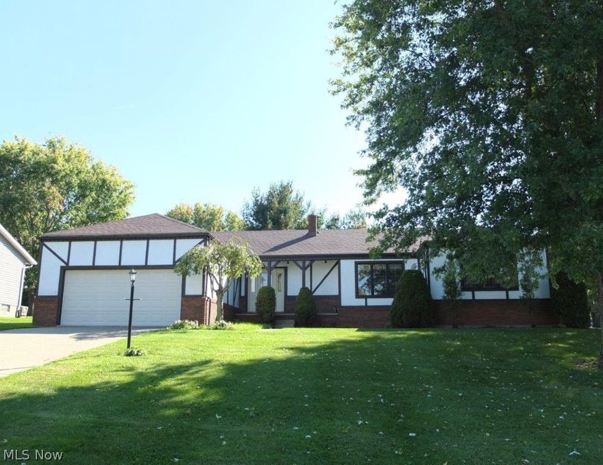 Beautiful, well maintained 3 bedroom, 2.5 bath, Tudor-style ranch with fantastic storage space, all on a corner lot! Comes fully applianced! Multiple living areas including a spacious formal living room and family room with wood burning fireplace. Eat-in kitchen has tile flooring, a breakfast bar, large dinette and comes fully applianced with a dishwasher, range, oven, refrigerator and over the range microwave. Formal dining room is open to the living room. Large master suite has double closets and a private full bath. There is an additional full bath and 2 good sized bedrooms - bedroom 3 has a large storage area. First floor laundry, washer and dryer included - a real bonus! Convenient half bath on the main level, too. The 2 car attached garage has high ceilings for bigger vehicles. Updates include: new roof, new furnace, new water softener and more! Nice backyard offers a large patio great for entertaining! Wonderful ranch home in great neighborhood. Come see all this home has to off