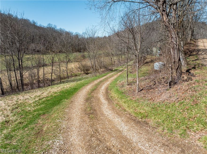 Live Auction 5/02/2026 10:00 AM - Parcel 3: 21.14 acres w/ 484’ frontage -This exceptional 188-acre offering of Holmes County land presents a rare to the market opportunity to own real estate in the well-known Stillwell area. Located just seconds from a paved road, the land features an older 3BR 2BA home, a 35' x 56' pole building, private septic, and a spring-fed water supply. The setting of the home offers peace and quiet, privacy, and ample land for gardening or animals. For the hunters, this property is situated in one of the county’s most sought-after hunting areas. Stillwell is well known for its hunting, and this property is no exception. Lots of deer trails, rubs, and scrapes, and each parcel is accessed from the east, providing favorable prevailing wind access and multiple ideal locations for food plots. A well-established trail system runs throughout the property, providing easy access. There is a nice ridgetop that spans most of the property, while the remainder of the land has a nice roll to it with a strong running creek, tons of road frontage, fenced pasture areas and ample building sites throughout. Most of the harvestable timber has already been marked and sold; these trees will be removed following the sale and are not included in the transfer. This selective harvest is expected to enhance the wildlife habitat and improve access with additional trails, bedding/cover, and browse. Whether you’re searching for a peaceful building site, prime hunting land, pasture ground, or just an investment, this property offers endless potential.