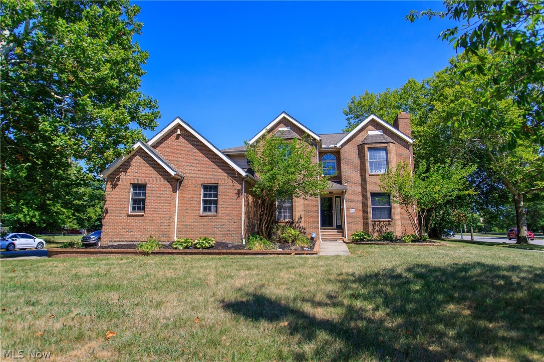 Welcome to 1921 E 66th! 4-bedroom, 4-bathroom brick colonial on a spacious corner lot offers, comfort, and style. With dual master suites, this residence is perfect for those seeking a blend of classic charm and contemporary convenience. Minutes from downtown, Cleveland Clinic, University Hospital, Case Western Reserve, Daves Supermarket, and much more. Enjoy the rare luxury of having master suites on both the 1st and 2nd floors. The 1st floor master features a Jack and Jill vanity, jetted tub, shower, walk in closet and double doors leading to the brick patio. The 2nd floor master boasts a walk-in closet with extra space, a master bath with a jacuzzi tub, and a shower. The eat-in kitchen offers plenty of storage, an island with a sink, and overlooks the backyard. Adjacent to the kitchen is a living room with high ceilings, a gas outlet for an additional fireplace if desired, and French doors leading to the brick patio. Host memorable gatherings in the formal dining room and unwind in the den, which features a cozy wood-burning fireplace. The 2nd floor includes two additional bedrooms and a full bathroom, providing ample space for family or guests. A convenient half bath is located on the main floor. The spacious 3-car attached garage offers plenty of room for vehicles and storage. The huge partially finished basement includes a kitchen area with space for a fridge and stove, making it perfect for a man cave, lady haven, theater room, or recreation space. The basement also has a full bathroom with a beautifully tiled oversized shower and glass block windows. Enjoy the fully fenced-in large backyard with a brick deck, perfect for outdoor entertaining and relaxation. The home is wired with Ethernet throughout, ensuring seamless connectivity. Additionally, there is a 1st floor laundry closet right off the master suite for added convenience. Don't miss the opportunity to own this stunning property – schedule a viewing today!
