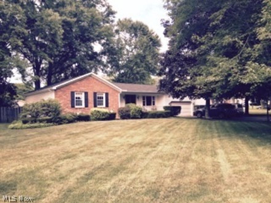 3 bedroom brick and vinyl home features living room, formal dining room, eat in kitchen, family room with fireplace, 2 1/2 baths, water proofed basement with guarantee, newer shingles and siding, central air, wooded lot.  Cement deck, fenced in yard, 2 car attached garage and more.  Back deck 24 x 15, front porch 24 x 4, 2 sheds.  Replacement windows throughout.