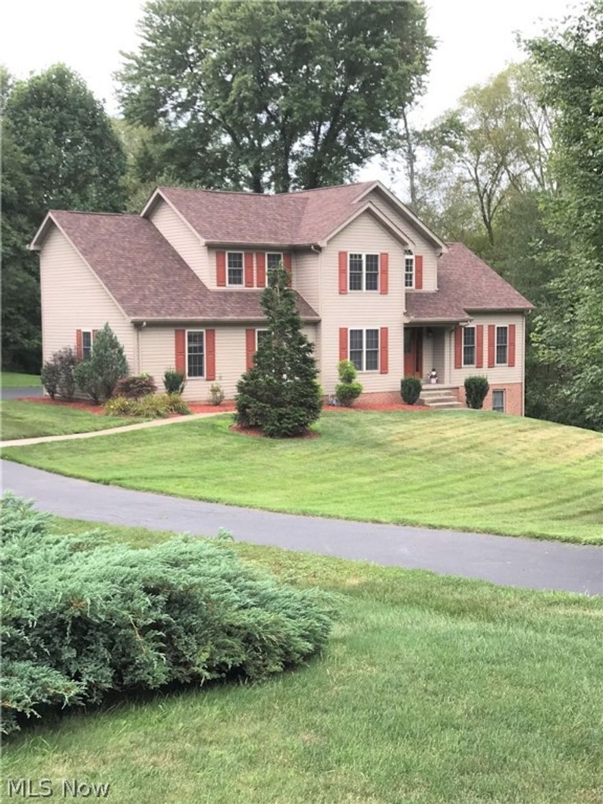 This 3 BR, 2.5 bath home sits on 1.8 acres, on a cul-de-sac, and is located just outside the village limits of East Palestine, OH. The first floor offers an open two-story entry, a spacious great room with vaulted ceilings, an office, powder room, an eat in kitchen, a laundry/mud room off of the two car attached garage, and a sun room with skylights. The second floor consists of two bedrooms with double closets, a full bath, and master suite with vaulted ceiling. The owner has completed many projects that had been left unfinished by the former owner. Those projects include: the LDY/mud room, interconnected fire alarms, LED dimmers on most light switches, a water softener, and filtration system. The finished walkout basement boasts a home theater, a work out area, a bathroom, a utility room, and additional space used as a bedroom. Extensive exterior work including drainage systems were also  completed. In 2018 a new roof was put on, and the rear deck was rebuilt.  You, your family, and