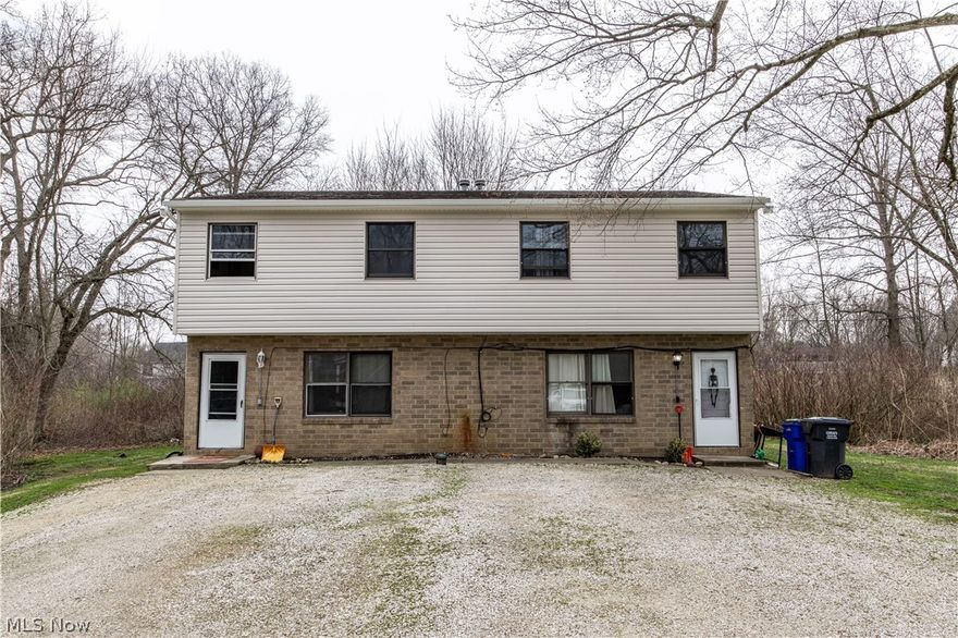 Turn-key side-by-side duplex offering an incredible opportunity for both owner-occupants and investors! Each unit features 4 bedrooms and 1.5 baths, along with a spacious living room, an eat-in kitchen, convenient first-floor laundry and exterior patios overlooking a peaceful, wooded lot. Situated on nearly an acre at the end of a dead-end street, this property provides privacy and space while still being close to everyday amenities. Tenants are currently month-to-month, with rents at $1,400 and $1,350, offering immediate income potential with flexibility for future plans. Recent updates include new siding and gutters, making this a truly move-in ready, low-maintenance investment!