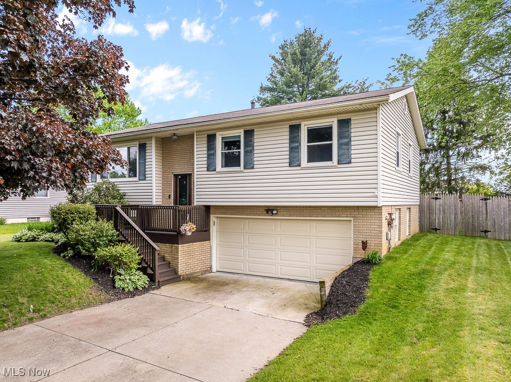 Location, lifestyle, and livability come together in this inviting 3-bedroom home in Wadsworth! It is just minutes from the vibrant downtown square (1 mile away), top-rated schools (Franklin Elementary 0.2 mile away), local parks, and all the everyday essentials. This spacious Bi-level offers over 1,700 finished square feet with fresh, neutral tones and thoughtful updates. Recent improvements include interior painting, new carpet in two bedrooms, updated flooring in the primary bedroom, and the addition of a new dishwasher and microwave in the kitchen. Upstairs, you'll find all three bedrooms and a full bathroom, with the kitchen opening directly to a freshly painted deck. Step down from the deck to a generous concrete patio and a large, FENCED backyard, perfect for entertaining, gardening, grilling, or simply unwinding outdoors. The outdoor space has been thoughtfully enjoyed by the current owners and is already equipped with a raised garden bed, sandbox, and a cozy fire pit - ideal for summer nights and weekend relaxation. The finished lower level of the home provides flexible space for a rec room, home office, guest area, or second living space. It also offers a half bath, laundry, and direct access to the attached 2-car garage. Designed for both everyday living and lasting memories, 221 Northpark Drive strikes the right balance of comfort, connection, and location. Come see it today!
