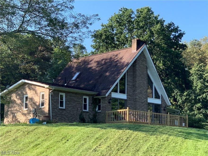 You will love this 3.5 acre property that provides a retreat from the bustle of city life to unwind. This tranquil 3-bedroom, 1 1/2-bathroom home is located just outside of New Philadelphia. Upon entering, you'll be greeted by contemporary lake house vibes, featuring a vaulted ceiling with a facade of windows and a cozy loft overlooking the living room. The first floor comprises a cozy kitchen, formal dining room, two serene bedrooms, a full bathroom, and laundry facilities, catering to all your essential needs. The full basement provides a blank canvas for you to create a personalized oasis of relaxation. Outside, a 3-car garage with a partial attached barn is available for your 4-H animals. The pasture offers ample grazing space for them to roam around. Finally, bask in the natural beauty from the expansive rear deck overlooking a picturesque pond that adds an elegant touch to this enchanting property throughout the year. Call today and schedule your private showing!