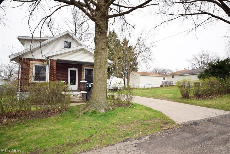 All Brick, extra lot included, 2 car garage with concrete driveway, Large living room with window seat, 1st floor bedroom w/half bath, formal dining room, brick patio with privacy fence and inviting front porch. Large second floor bedroom with full bath and loft. Full basement with glass block windows. Water tank 2013. All appliances stay.