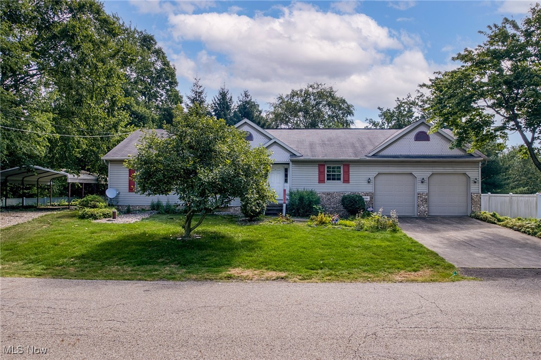 Beautifully Maintained Ranch in Prime North Canton Location! Built in 1995, this vinyl-sided ranch offers the perfect blend of comfort, functionality, and convenience. The welcoming front porch and attached 2-car garage set the stage, while a large carport with concrete pad and separate driveway provides ideal storage for boats, campers, or extra vehicles. Step inside to a bright and inviting living room featuring a gas fireplace, vaulted ceiling with skylights, and an open dining area with patio doors leading to a sunroom and backyard. The updated kitchen boasts oak cabinetry, granite countertops, a stylish glass backsplash, stainless steel appliances, and a pass-through opening to the living area for easy entertaining. A spacious laundry room is conveniently located off the kitchen with direct access to the garage. The office with French doors (complete with a closet) could easily serve as a third bedroom. The main full bath offers a walk-in shower, while the primary suite features its own private bath with double sinks. The huge finished basement adds incredible living space with built-in cabinets, a sink, and a half bath—plus a large unfinished area offering plenty of storage. Home being sold AS IS. Situated in sought-after North Canton, just minutes from shopping, highways, and restaurants, this home combines style, space, and location for the ultimate in easy living. Schedule your showing today!