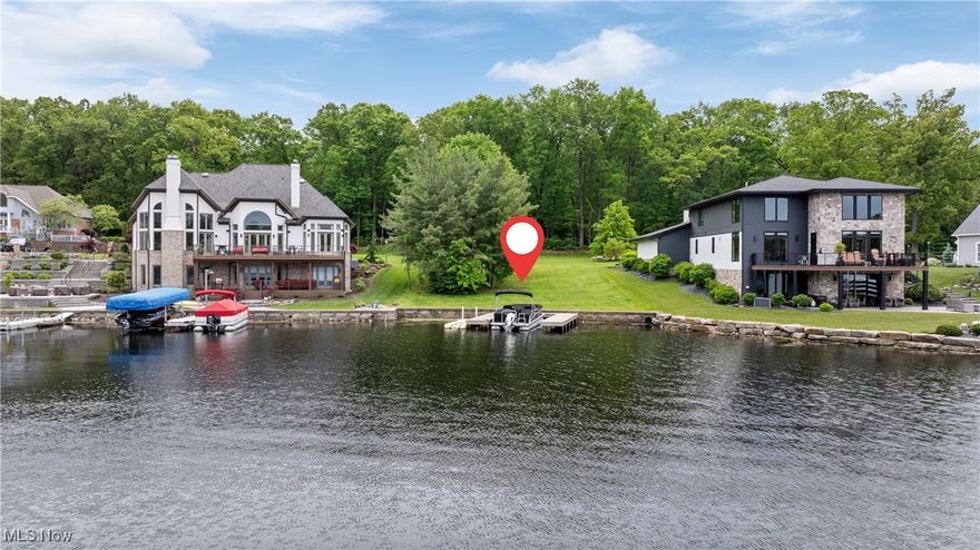 Build your dream lakefront home in the prestigious Diamond Shores community—the only gated neighborhood on the Portage Lakes and part of the highly rated Green Local School District. This beautiful, buildable gently sloping lot offers 68 feet of frontage on the quiet and scenic Cottage Grove Swim Lake, part of the desirable Main Chain of the Portage Lakes. Perfect for a walkout lower level home. With nearly a quarter acre of land, you'll enjoy both sunrise and sunset views in a tranquil, upscale setting. The lot features public sewer access and underground utilities already in place, along with a newer seawall and private docks- parking for three boats. You’ll love the freedom to bring your own builder and design a custom home that fits your vision, surrounded by luxury residences in a peaceful, private setting. Just a short ride from East Reservoir's speed and ski lanes, and bordered by protected State Park land, this location offers both quiet natural beauty and easy access to water recreation. Opportunities like this are rare—don’t wait to build the lakefront lifestyle you’ve been dreaming of.