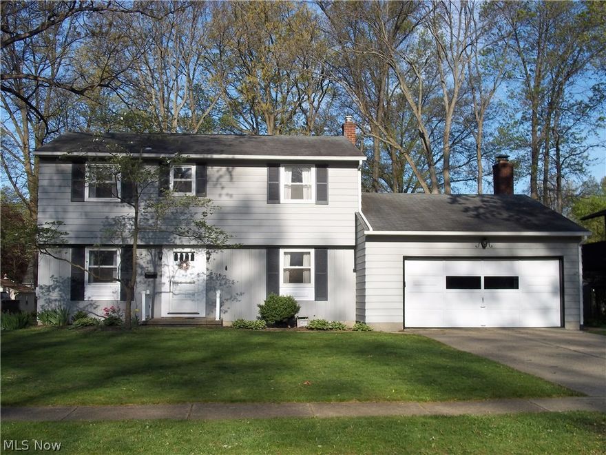 Classic Center Hall Colonial in the heart of Stow! This 4 BR, 2.5 Bath home has been tastefully updated! Fully applianced, eat-in kitchen with breakfast bar opens to the sunken family room. Family Room features custom built-ins, gas fireplace and a sliding glass door that leads to the charming brick patio. Huge living room with built-in corner cabinet and gleaming hardwood flooring. Formal Dining Room also boasts hardwood flooring. Convenient powder room on the main floor. Upstairs you will discover a spacious master suite with a newly renovated full bath. Three additional bedrooms and the updated main bath complete the 2nd floor. Main bath features double sink, white cabinetry and ceramic tile flooring. All the bedrooms have hardwood flooring. The lower level includes a 14 X 25 rec room and a 12 X 16 office plus plenty of room for storage! Updated Mechanicals include a newer furnace, hot water tank and vinyl windows. Parklike backyard! All this on a beautiful tree-lined street! Walk t