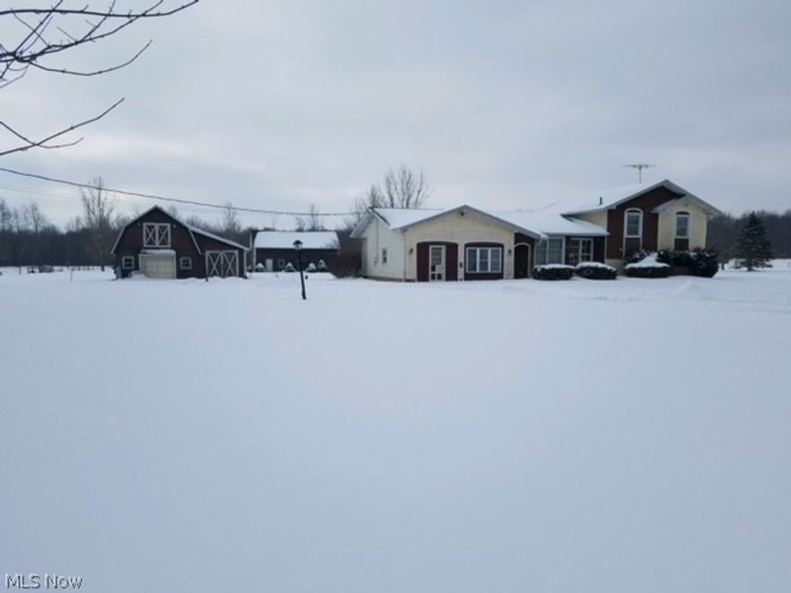 Solid bones on this split level house featuring 4 levels. Main floor has living room, foyer, and kitchen with eating space leading to a back deck via a sliding door. Step up to 3 bedrooms and a full bath. Stairs down lead to the family room with fireplace equipped with a wood burner. There is also the fourth bedroom and another full bath. The basement is accessed from the lower level. The garage was converted to additional living space and has a half bath. Outside are two additional buildings. Property being sold "AS IS". Seller will make no repairs. 

House with 5 acres available under MLS 4257108 for $215,000.