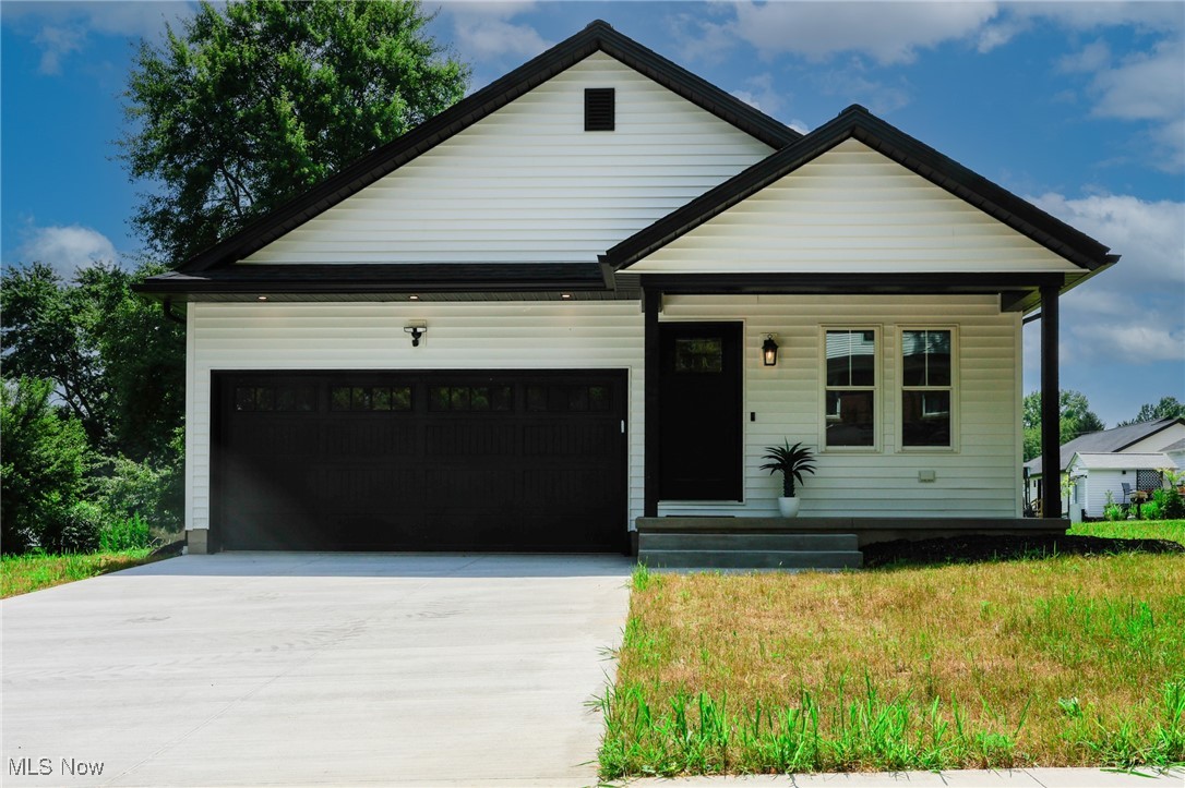 This just-finished new build in Marshallville is ready to impress. It's part of a growing neighborhood of new homes, but unlike a cookie-cutter development built by one builder, each home here has its own character. This one stands out with a bold black and white exterior and clean, modern finishes throughout.
Inside, you'll find 3 bedrooms, 2 full baths, and 2,231 square feet of beautifully finished living space. The open layout flows from the kitchen to the living area, making everyday life and entertaining easy. The primary suite includes a beautifully tiled walk-in shower that adds a touch of luxury. First-floor laundry adds convenience, and the newly finished basement offers over 800 square feet of bonus space with high ceilings. It is perfect for a gym, rec room, home theater, or extra living area.
Located in the Green LSD school district in Wayne County, this home is perfect for anyone wanting stylish one-floor living with the bonus of a spacious finished lower level. Homes like this don't last. Schedule your showing today.