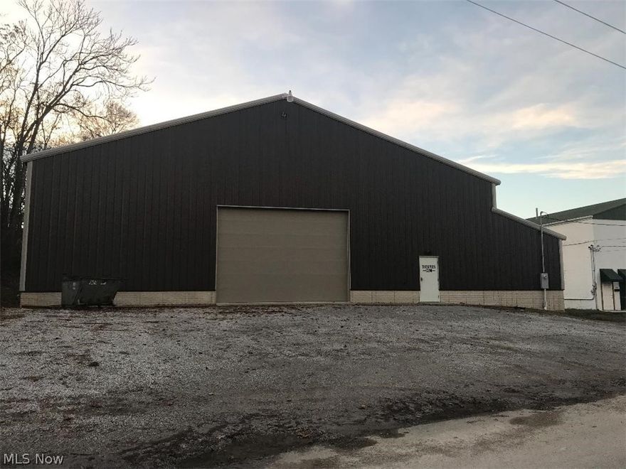 Sports enthusiasts take notice! Endless opportunities abound with this outstanding quality-built newer construction (2015) "full-size" gymnasium, ideal for a variety of recreational activities and sports, including basketball, baseball, tennis, volleyball, badminton, and so much more! Equipment included in the sale consists of two portable basketball hoops, retracatable batting cage, a pitching machine (for both baseball and softball), portable poles for volleyaball, tennis, and badminton, and five new metal team benches. This building boasts nearly 9,000 square feet of open recreational space, an equipment storage/utility room, and two restrooms (one of them plumbed for a shower).  The building has both heating and cooling sytems. There is a gravel parking lot for several vehicles located in front of the building and additional space on the side of the building which could be developed to provide several additional parking spaces if needed.