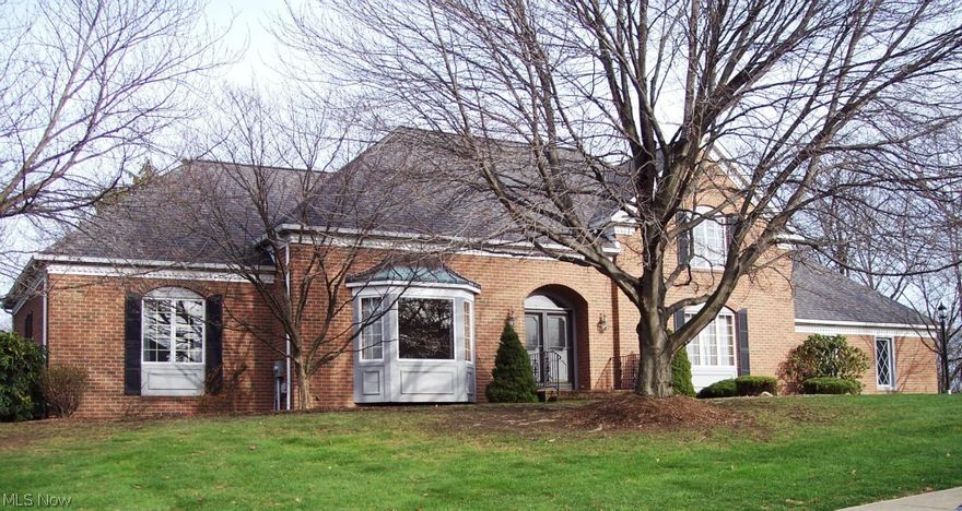 Immediate possession!  Custom built brick 1.5 story home in The Ellendale Allotment.  Built in 1988 this home features a large tile foyer, formal dining room, eat-in equipped kitchen leading to a 12 x 26 deck, first floor laundry, family room with gas fireplace, living room, first floor master suite with double walk-in closets, glamor bath w/sunken garden tub.  Grand staircase leads to two additional bedrooms and full bath.  Also on second floor is an attic area that could be finished for an additional bedroom.  The parcel to the east of the home may also be purchased.  Call for a price.