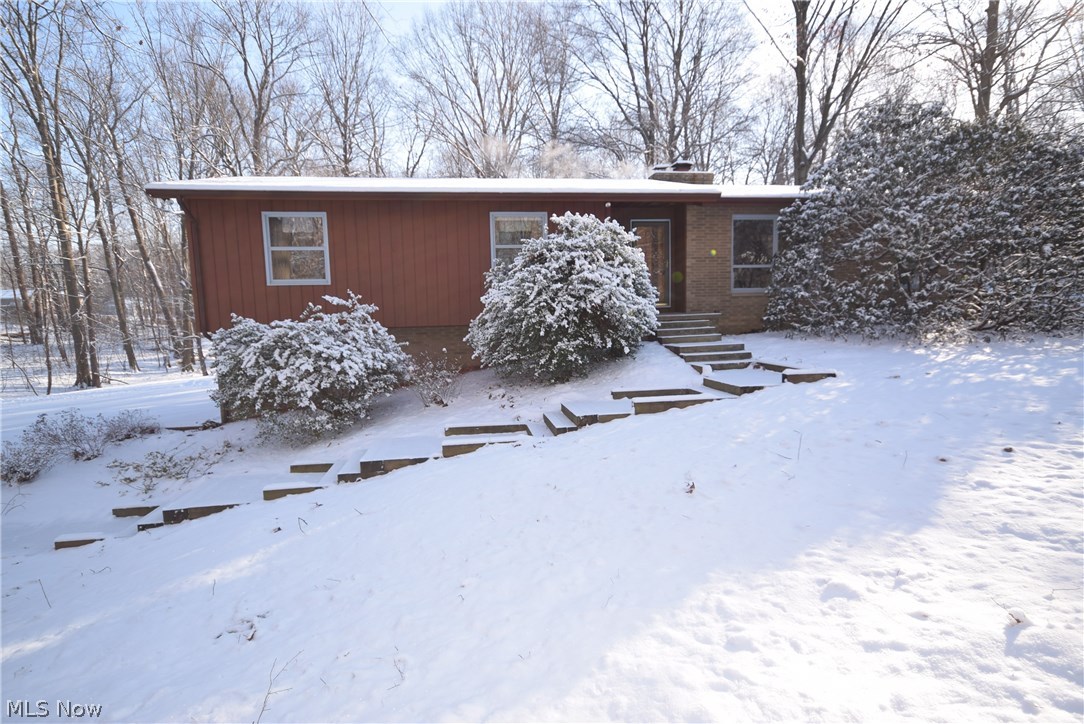 Gorgeous private wooded setting. 4Bedroom raised ranch in Green LSD! Over 1 acre of land and over 2000 Sq ft of living space! 3 fireplaces! Large living spaces! Master bedroom and second bedroom lead to a balcony deck providing peaceful views of the private backyard. Spacious kitchen open to large dining area. Finished walkout basement with rec. room with built in bar, fireplace and full bathroom. Rec room has a large patio door for great natural light and leads to the patio. Large 2 car attached garage and extra storage garage. Large newer concrete driveway. This property has been well cared for and is ready for new owners. Don't miss your opportunity to own this serene setting! Call today to schedule your personal tour!