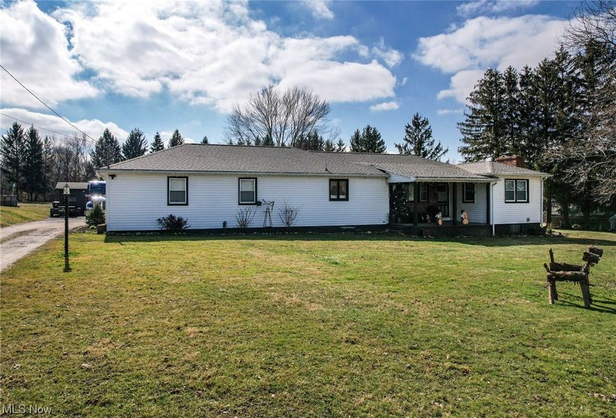 This updated ranch on 2.5 acres in South Range Schools offers privacy and fun! The home has a new roof, new appliances and a fully finished basement. The first floor offers three bedrooms, a bath and a spacious open kitchen and living space with a fireplace. The basement has new flooring, a game room, laundry, 1/2 bath, family room and office. Outside there are so many options: a 12 X 12 playhouse, a chicken house, a pool, an extra storage building and lots of parking area. Also, the garage is drywallled and deep enough for large trucks. Don't miss seeing this!