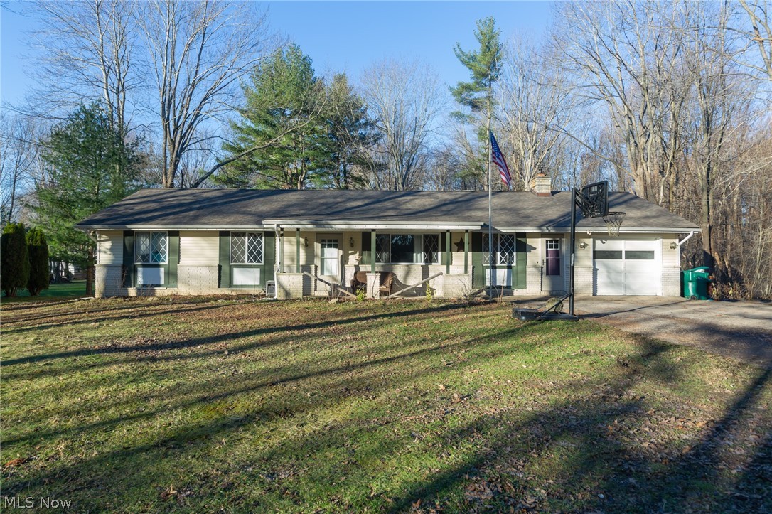 Easy one floor living on a wooded lot! Open floor plan offers flexibility to use the space in different ways. Pellet stove located in the vaulted dining area gives an option over baseboard heat. Kitchen is updated and appliances stay. Covered porch along the back of the home is a perfect place to enjoy the private, wooded views. Home has room for sweat equity so you can make it your own! Located near Laurentia Winery, Hogback Ridge Park, Hidden Valley Park. Quick drive to access Route 90.
