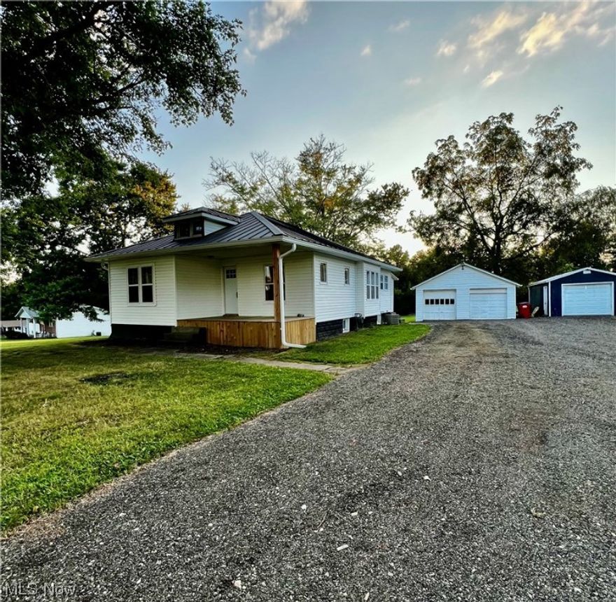 Cute 2 bedroom on 2 pretty acres! Inside you have the charm of original woodwork throughout, large dining room, cozy living room with fireplace, bonus room off of one of the bedrooms would make nice walk in closet or cute nursery.  Kitchen has new wiring, plumbing and drywall and is ready for new buyer to finish with cabinetry and appliances. There is a nice enclosed porch leading from outside to the kitchen.  Home has new siding, new metal roof and new front deck, there is a 2 car detached garage and a separate one car garage.  Convenient to Interstate 70 access.  Septic new in 2017. Property has 2 parcels