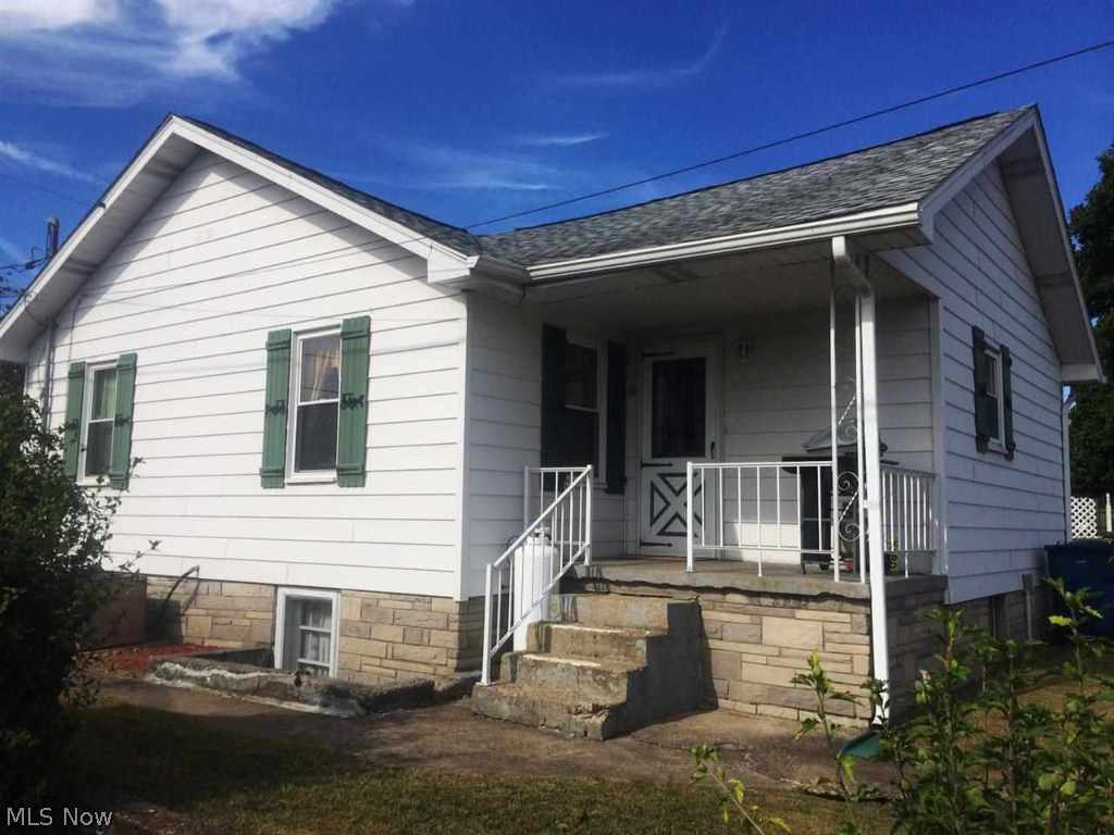 Very well kept, cozy home w/ a flat yard featuring an oversized 2 car garage & a storage shed. This 2 BR, 1 BA house has had several updates, including a new laundry rm on the main level, updated electric, replaced roof & high eff windows as well as new garage doors - all w/in past 3 yrs. Home Warranty included!
