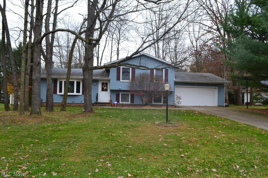 Lots of space in this four bedroom home in Plain Township.  The living room with a brick wood burning fireplace has  new carpet and fresh paint and is open to the dining room. Dining room has walk-out to the large fully fenced treed backyard with heated pond with fish and waterfall.  The backyard is great for kids or pets!  The kitchen has resurfaced cabinets, fresh paint, and a newer floor. The family room has a newer door and built-in seating area.  This floor also has a bedroom with a full bath which was remodeled and has a ceramic tile floor.  The upper level has three bedrooms, one with new carpet, and another full bath. A great family home!