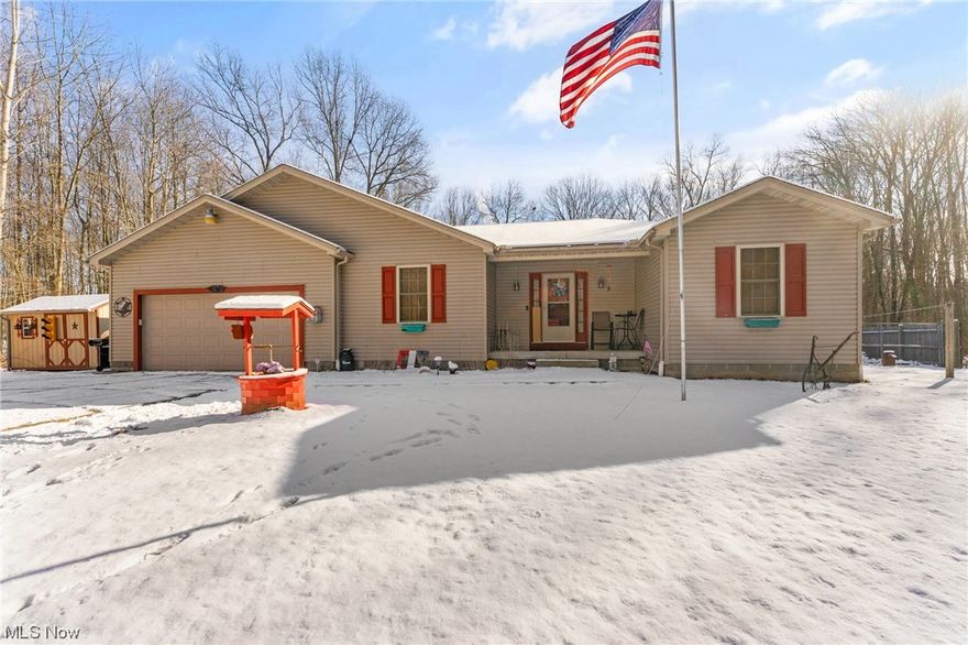 Want a Ranch on property? 11.15 acres sounds like the perfect property! This house has 3 beds, 2 full baths and just under 2000 sq ft that also includes a full wet bar in the basement. This house was built in 2005. The home welcomes you on the front porch that leads into a large foyer area with vinyl flooring and 2 coat closets. The living room has newer carpet with a gas fireplace and plenty of space for the family! The eat-in kitchen has plenty of cabinet space, luxury plank flooring, laminate countertops, a subway tile backsplash and stainless appliances. There is an access to the back deck area with a fenced in backyard and also access to the first-floor laundry room. A formal dining room that can host a large gathering with a country style feel. The primary suite is tucked away on one side of the house with carpet, a walk-in closet and a full bathroom with garden tub and double vanity. The other 2 bedrooms are on similar sized rooms with carpet and double-sized closets. The basement hosts a one-of-a-kind wet bar area with restaurant seating booths and bar stools ideal for the people who like to entertain! There's plenty of storage throughout the basement. Glass block windows. New Gordon Brothers chlorination system. Well and new septic. Hi-efficiency furnace and heat pump. Dimensional shingled roof. Vinyl siding and vinyl windows. 2 car attached garage. Large shed/garage for additional storage. Youngstown City Schools with Lowellville open enrollment option. This house will not last so jump on this while you can. Limited inventory with property so call us today and schedule an appointment!!