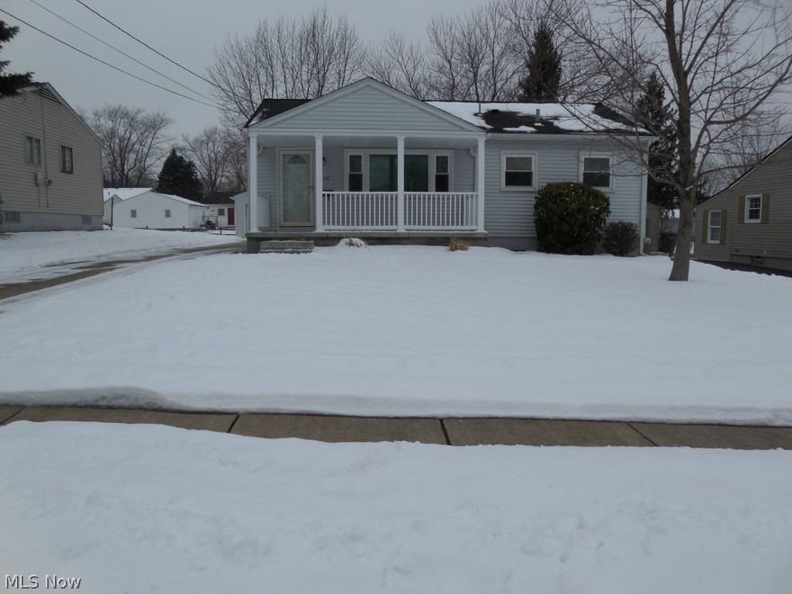 Meticulous totally updated 3 bedroom 1 bath home that shines from the outside in. Outstanding kitchen featuring ample rich medium oak cabinetry with pantry equipped with newer Frigidaire stainless steel refrigerator, gas stove and sink. Bright updated bath and neutral decor throughout and some beautiful wood floors. Residence features newer furnace/air (2002)...newer roof, vinyl siding, windows, front and back porch, drive.  The freshly painted basement is as pristine as the main floor and perfect for family gatherings...and washer and dryer are included! Home reflects pride of ownership. Home warranty included. Call today because you deserve it....it's turn key and waiting for you.