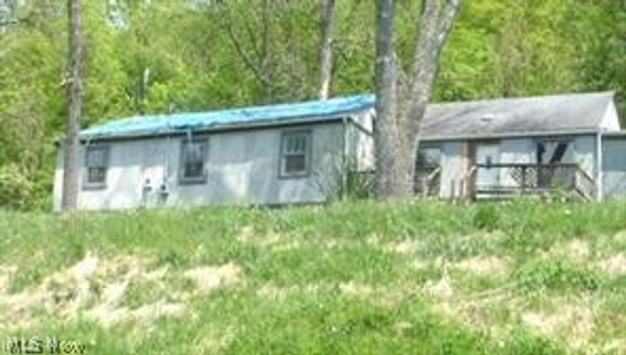 If you're looking for a weekend retreat or year round home, don't miss seeing this one situated across from the river on State Route 60 between Zanesville and McConnelsville. Large detached garage and ranch home on .67 acre lot with river view. Needs some TLC but has lots of potential!!